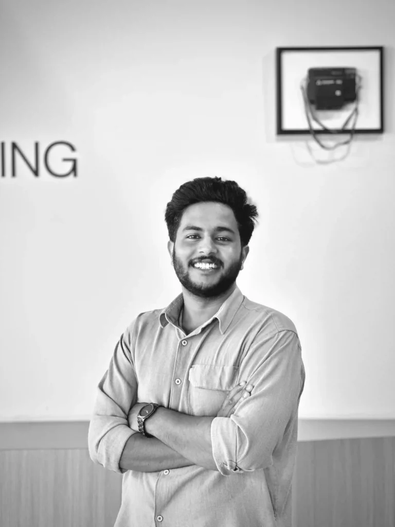 Best Digital Marketing Freelancer In Thrissur standing indoors with his arms crossed